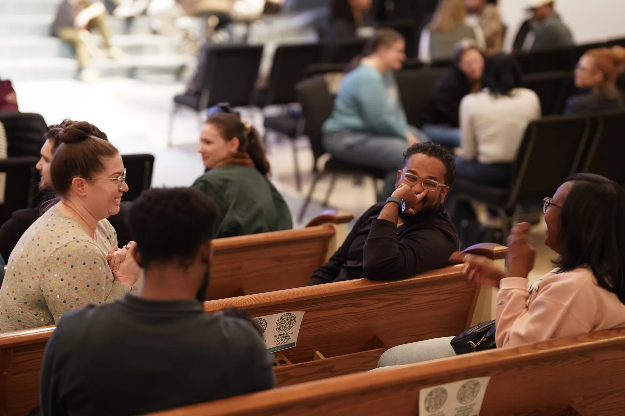 The congregation seated in the pews on a Sunday morning