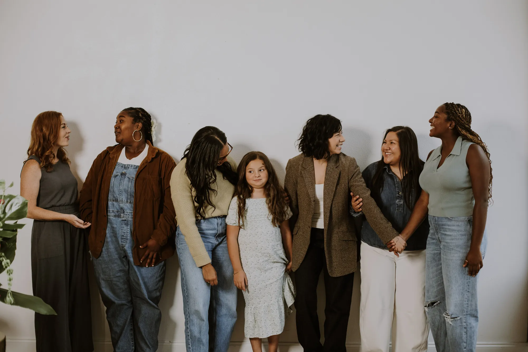 A line of friends standing arm in arm