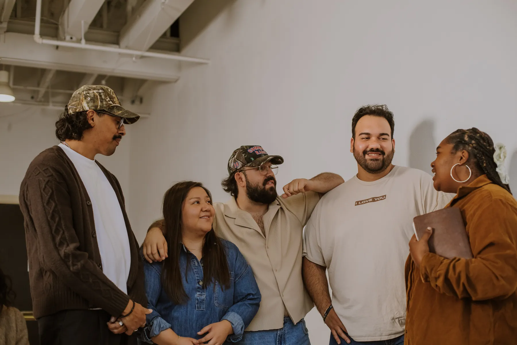 Five friends laughing together