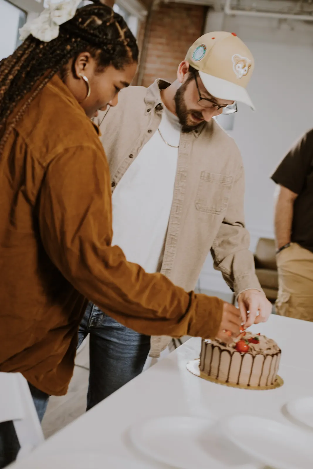 Cutting a cake together at the end of the meal