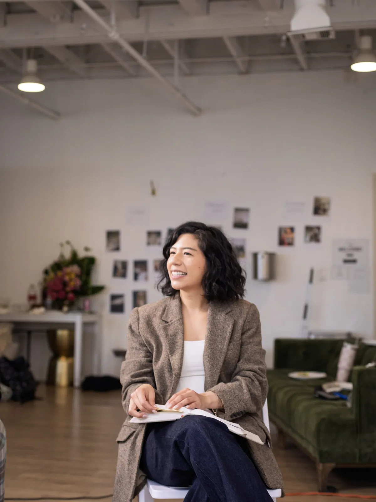 A woman laughing in the studio