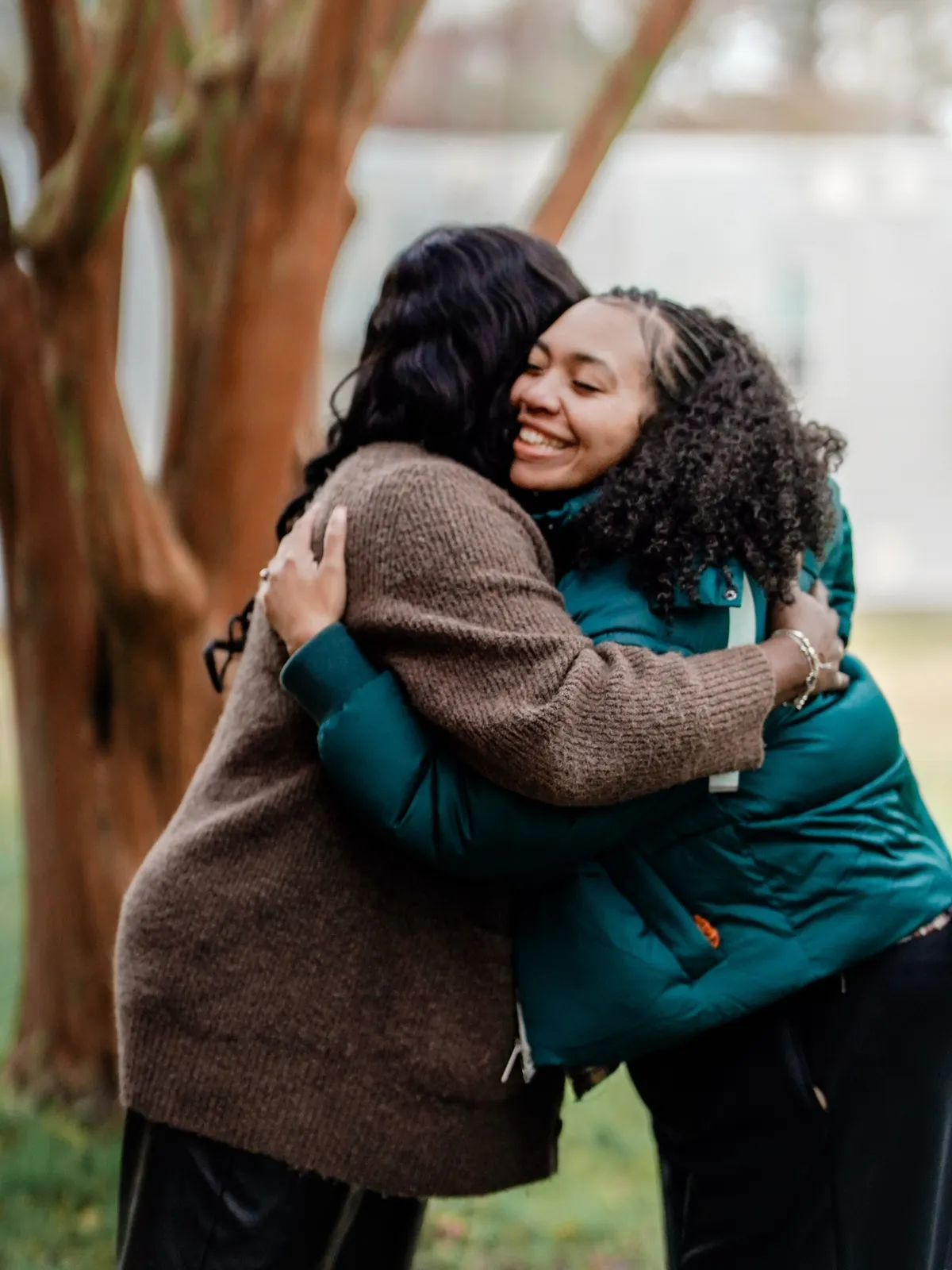 Two women hugging outdoors